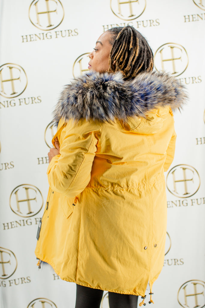 yellow cloth parka with detachable raccoon fur vest lining & raccoon fur trim hood