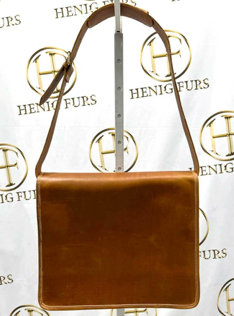 front of cognac leather messenger bag