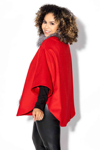 red wool blend cape with indigo fox fur trim