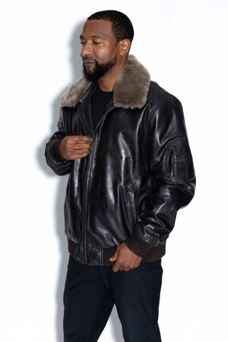 man wearing a brown leather bomber with detachable wool collar against a white backdrop