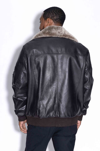 back of man wearing a leather bomber jacket with detachable wool collar against a white backdrop