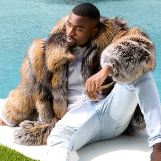 man wearing a fox fur bomber jacket, sitting by the pool