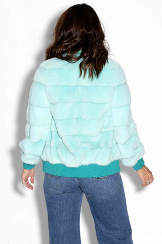 back of mint nafa mink fur jacket against a white backdrop