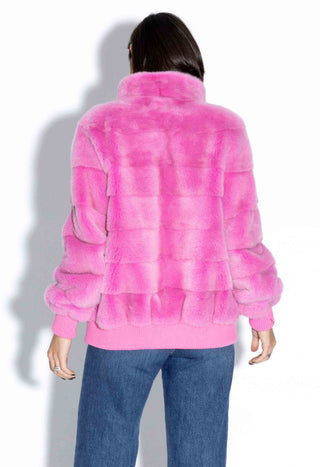 back of pink nafa mink fur jacket with horizontal pattern against a white backdrop