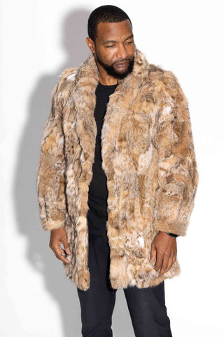 man wearing a men's sectioned bobcat fur stroller with shawl collar against a white backdrop