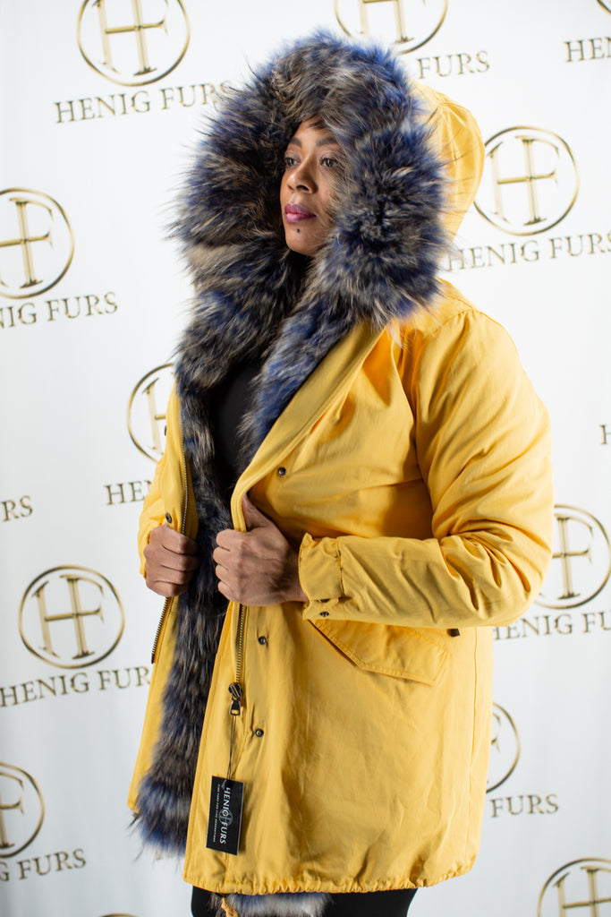yellow cloth parka with detachable raccoon fur vest lining & raccoon fur trim hood