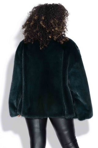 back of evergreen full skin mink fur jacket against a white backdrop