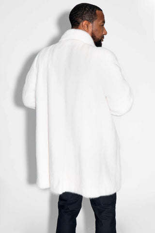 back of man wearing a white female mink fur stroller against a white backdrop