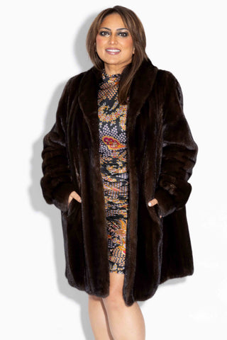 smiling woman wearing a mahogany female mink fur stroller 