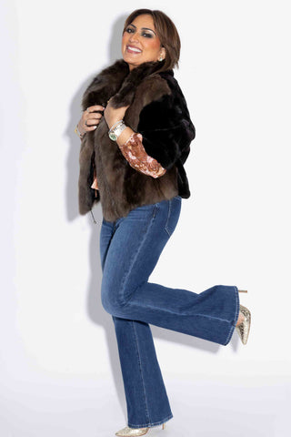 smiling woman wearing a Sectioned Mink Fur Jacket with Russian Sable Fur Front against a white backdrop