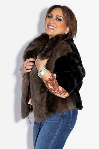 closer view of smiling woman wearing a Sectioned Mink Fur Jacket with Russian Sable Fur Front against a white backdrop