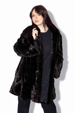 black sheared sectioned fur stroller with ruffle trim