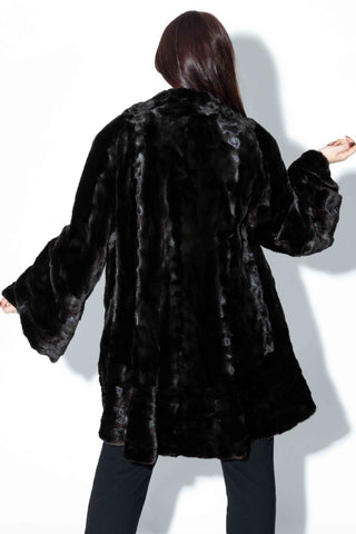 black sheared sectioned fur stroller with ruffle trim