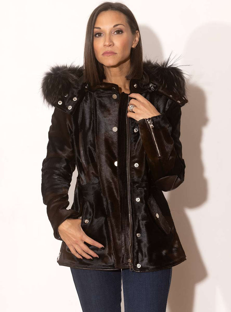 brown cowhide jacket with raccoon fur trimmed hood