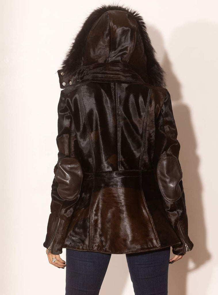 brown cowhide jacket with raccoon fur trimmed hood