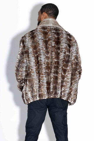 back of man wearing a gray cross sheared sectioned mink fur bomber jacket with mink fur collar against a white backdrop