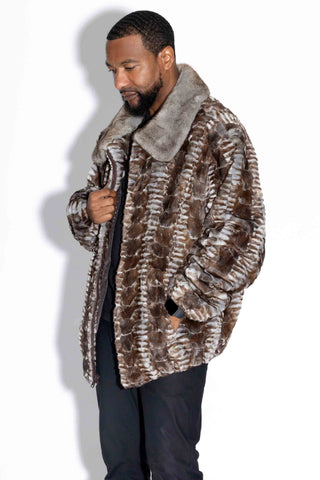 side profile of man wearing a gray cross sheared sectioned mink fur bomber jacket with mink fur collar against a white backdrop