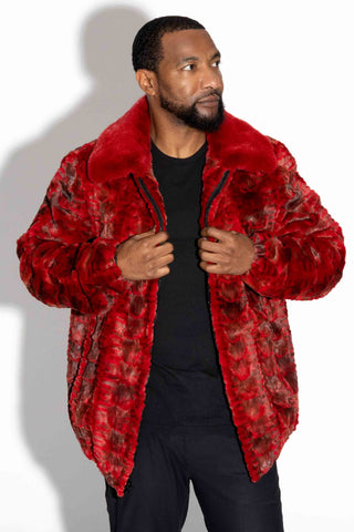 man wearing a red sheared sectioned mink fur bomber jacket with mink fur collar against a white backdrop