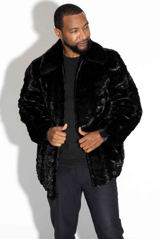 man wearing a ranch (black) sheared sectioned mink fur jacket with mink fur collar against a white backdrop
