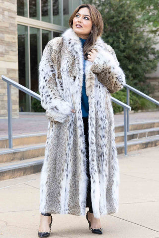 woman wearing a bobcat fur coat on the sidewalk
