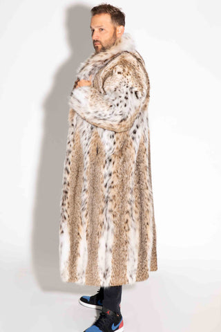 side profile of a man wearing a full skin custom-made bobcat fur coat with shawl collar against a white backdrop
