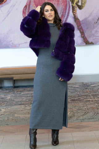woman wearing a purple fox fur bolero jacket with horizontal pattern and hood