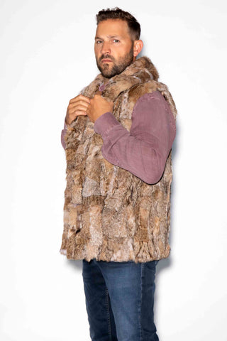 side profile of man wearing a sectioned bobcat fur vest with shawl collar against a white backdrop