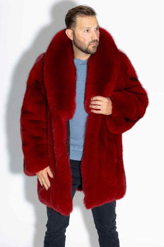 man wearing a custom-made red fox fur stroller against a white backdrop
