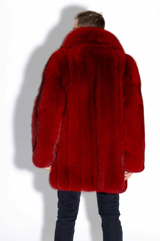 back of man wearing a custom-made men's red fox fur stroller against a white backdrop