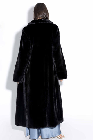 back of blackglama ranch mink fur coat against a white backdrop