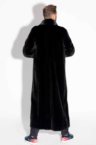 back of man wearing a men's custom-made full length ranch mink fur coat against a white backdrop