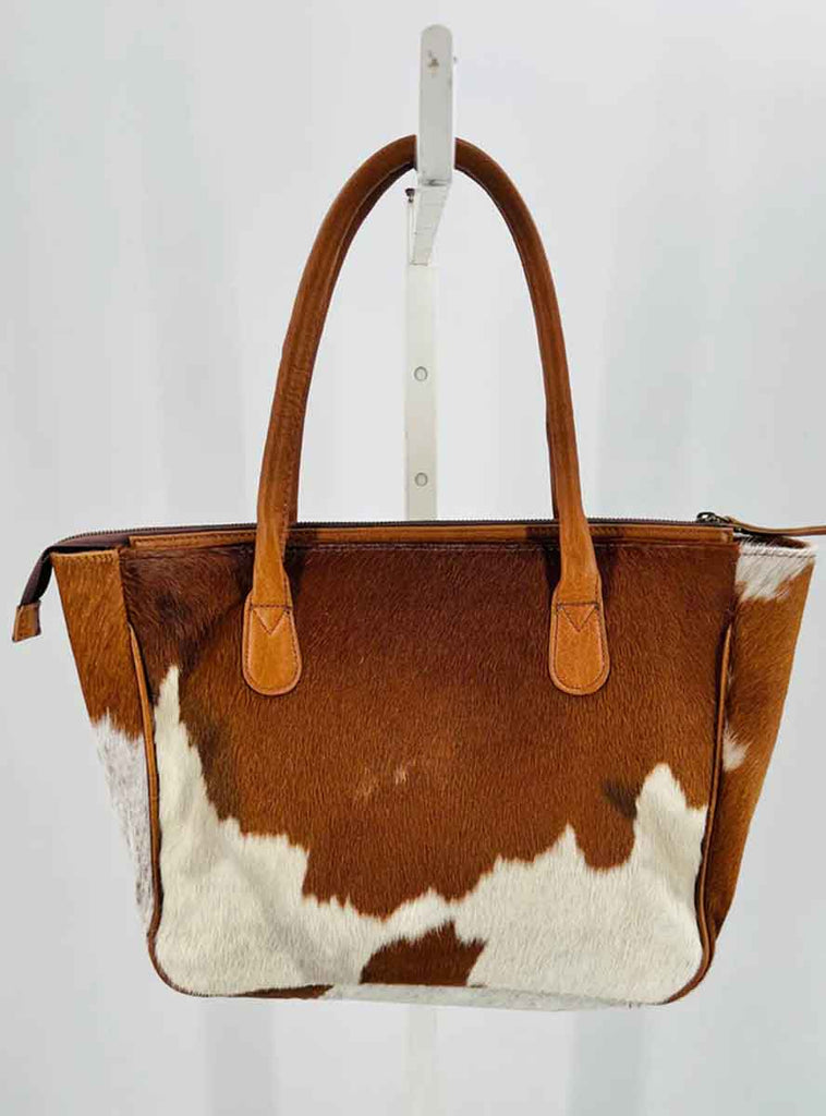 cognac cowhide and leather purse with matching cowhide wallet