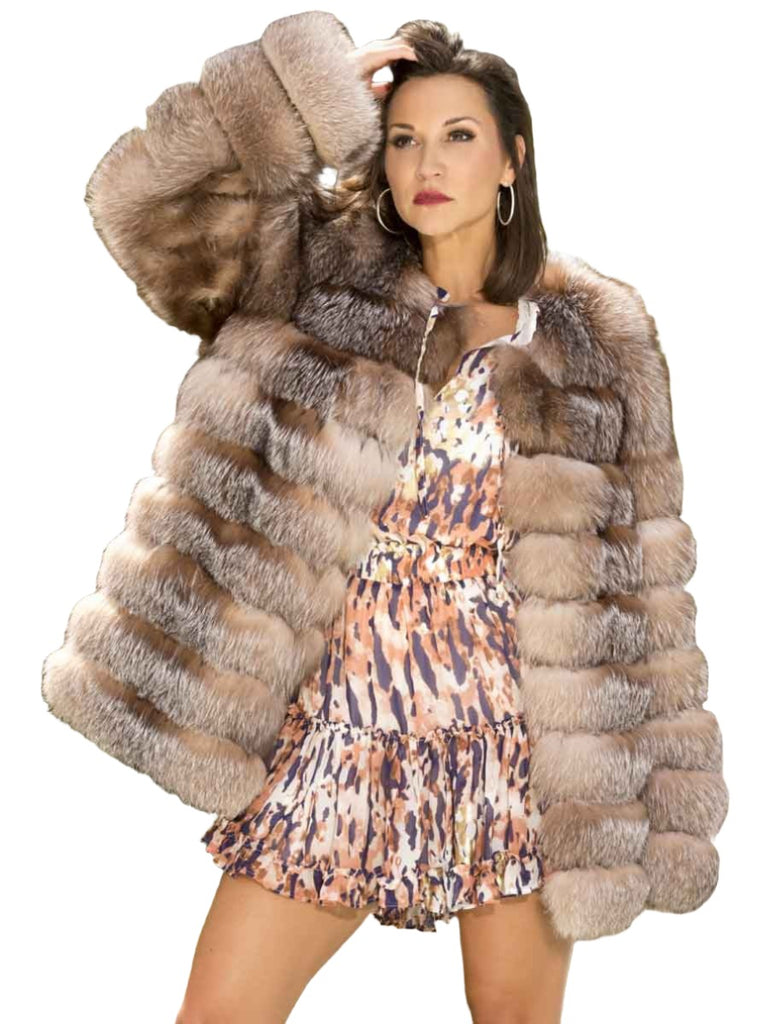 woman wearing horizontal pattern crystal fox jacket outside with trees surrounding - Shop our Women's Furs!